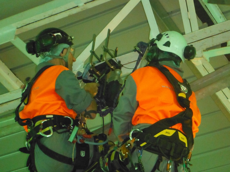 Drilling holes for specialised equipment to be mounted into roof beams